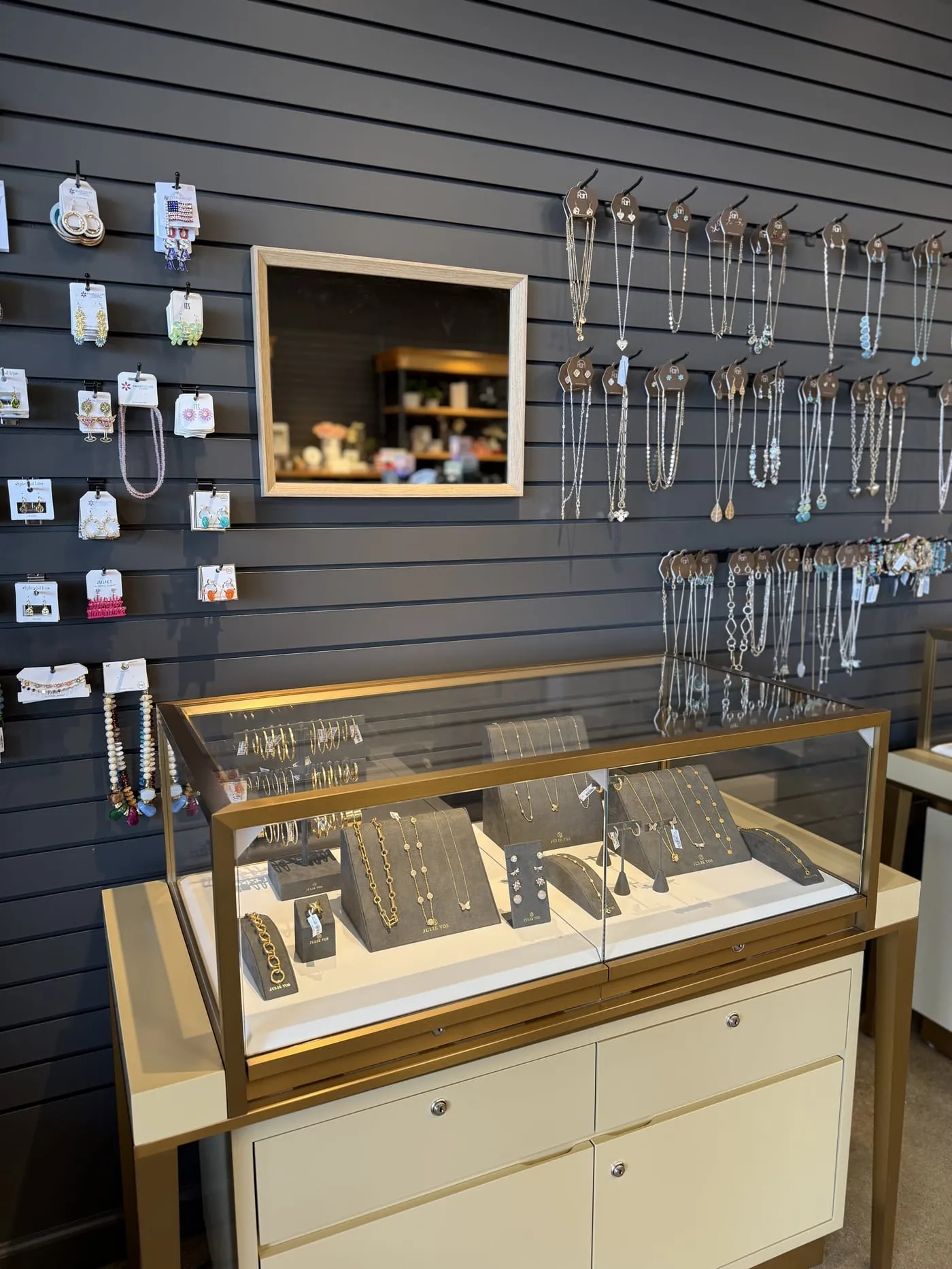 Jewelry wall and display cases at Gugu Gifts in Terrell, TX