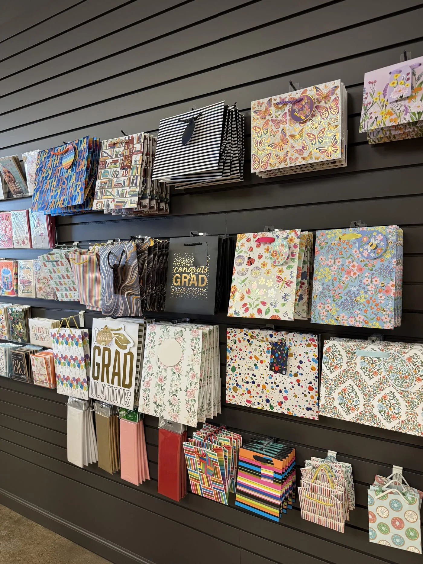 Wall of gift bags and wrap at Gugu Gifts in Terrell, TX